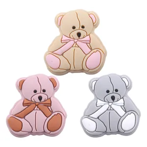 Cute cartoon bear silicone charms in pink, beige, and grey for DIY pacifier clips and shoes