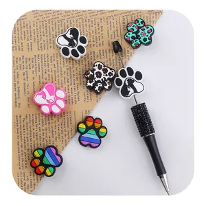 Detail of beadable pen with rhinestones and seven assorted silicone cat paw charms