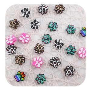 Detailed set of colorful animal paw print shoe charms with leopard and polka dot patterns