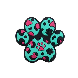 Detailed view of mint green silicone animal paw bead with pink and black leopard print