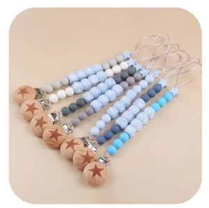 Detail view of colorful silicone beads and beech wood clips for baby pacifier chains