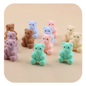 Macro shot of colorful silicone bear beads in macaque colors for DIY baby pacifier clips