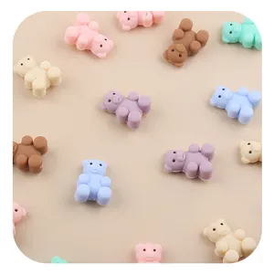 Macro shot of colorful silicone bear beads in pastel tones for DIY pacifier chains