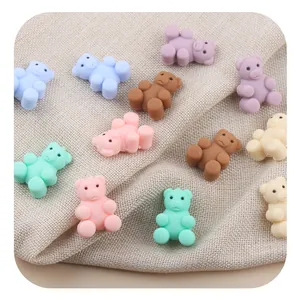 Detailed view of colorful cartoon silicone bear beads for DIY baby pacifier clips