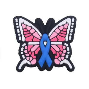 Pink and white butterfly shoe charm with blue ribbon detail for clog decoration