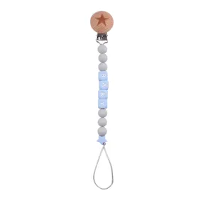 Detail of beech wood clip with silicone beads and BABY letter beads pacifier chain