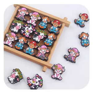 Macro detail of cartoon highland cow silicone beads for creative DIY pacifier chains