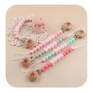 Pink silicone baby pacifier and beech wood clips set with star and letter beads
