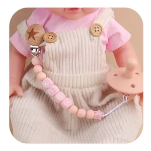 Pink silicone baby pacifier clip with wooden star holder and BABY letter beads