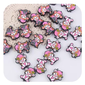 Cute highland cow silicone charms in pink outfits for DIY pacifier chains and accessories