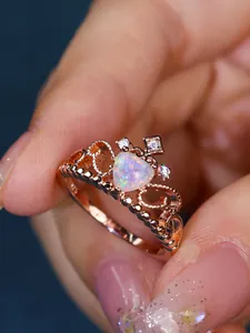 Macro view of S925 rose gold crown ring with heart-shaped opal and cz stones