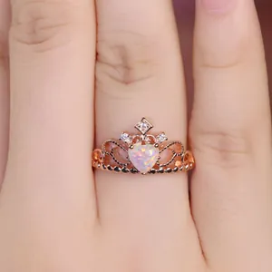 Elegant rose gold crown ring for women featuring a heart-shaped opal and small diamonds