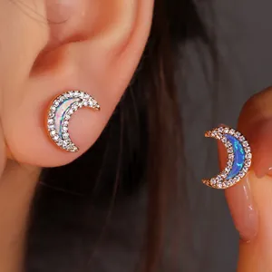 Crescent moon stud earrings with iridescent opal and sparkling crystal halo in gold finish