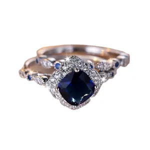 Square sapphire blue crystal ring set in polished silver finish with pavé diamond halo