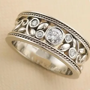 Vintage baroque hollow floral wide ring in silver with round white gemstones