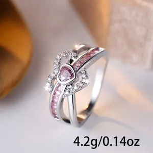 Double-layered silver heart ring with pink gemstones and pavé stones weighing 4.2g