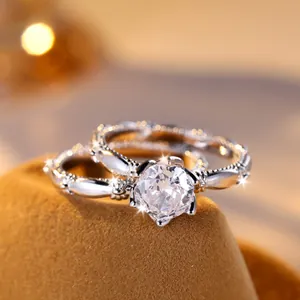 Elegant silver ring set with round white diamond solitaire and textured band in soft light