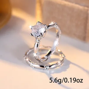 Silver bridal ring set with sparkling white diamond and textured band weighing 5.6g