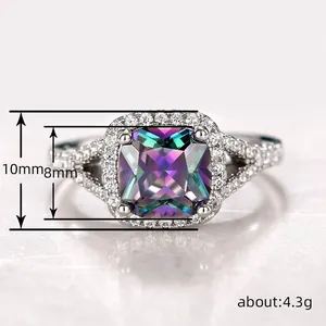 Macro shot of 10mm square mystic topaz ring with halo diamonds and split shank