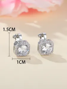 Macro shot showing 1.5cm by 1cm dimensions of square sparkling zircon stud earrings
