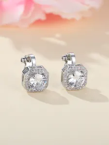 Macro shot of square halo clip-on earrings with large zircon and silver finish