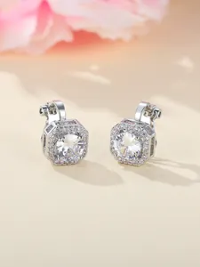 Close-up of octagon silver ear clips featuring a large round zircon and halo design
