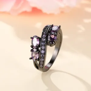 Irregular black gold ring with purple zircon stones and S925 silver stamp on jewelry