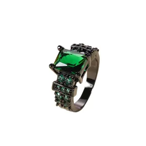 Vintage emerald-cut green zircon ring with black plating and tiered pave side stones