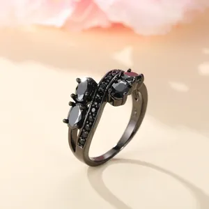 Irregular black gold plated S925 silver ring with criss-cross design and zircon stones