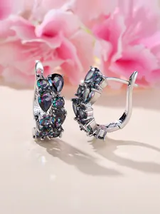 Detail view of silver earrings with pear-cut rainbow gemstones and lever-back closure