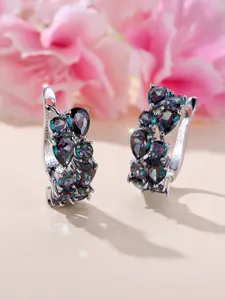 Macro shot of silver hoops with rainbow mystic topaz in pear and round cuts