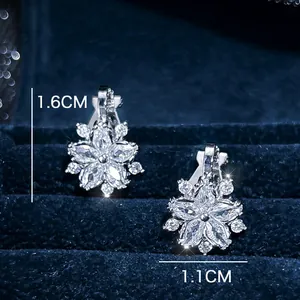 Elegant silver flower earrings with white crystals on navy velvet background, 1.6cm size