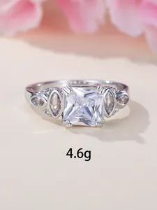 Macro detail of princess cut white zircon ring with marquise side stones and 4.6g weight