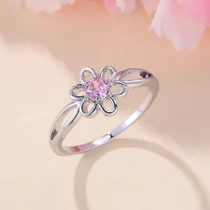 Elegant silver flower ring with a round pink gemstone centerpiece for women