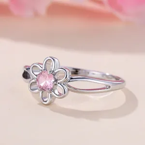 Silver flower ring with pink zircon center and hollow double band design for women