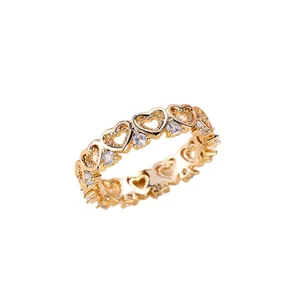 Elegant gold hollow heart ring featuring sparkling white cubic zirconia stones set in bands