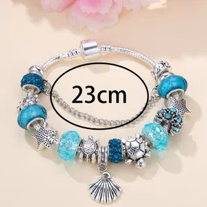 Elegant 23cm ocean theme charm bracelet with blue crystal beads, starfish and shells