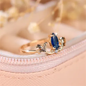 French vintage gold ring with royal blue marquise stone and feather details