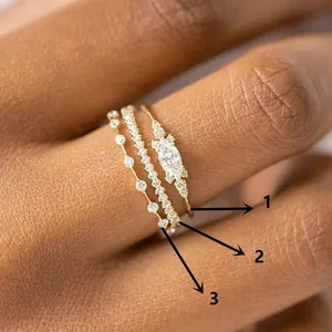 Ensemble de trois bagues empilables dorées avec pierres marquises et cristaux de zircone pavés