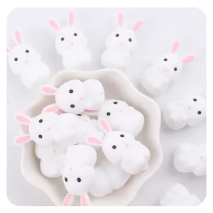 Macro shot of white cartoon rabbit silicone teething beads for baby pacifier clips