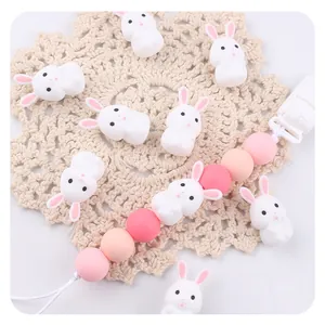 DIY silicone baby teether beads and rabbit pacifier clip set in soft pink and white tones
