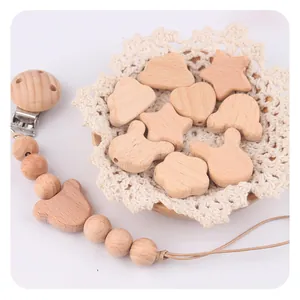 Detailed set of natural beech wood baby pacifier clip and various DIY teething beads