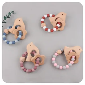 Baby beech wood and silicone teething rings with cartoon bird and flower shapes