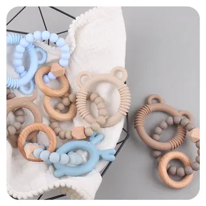 DIY Beißringe aus Buchenholz und Silikon-Bären in Pastellfarben für Babys