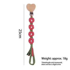 Handmade woven daisy pacifier clip with heart wooden buckle and cotton tassel, 25cm length