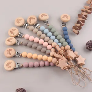 Handmade beech wood pacifier clips with silicone beads and star pendant in multiple colors