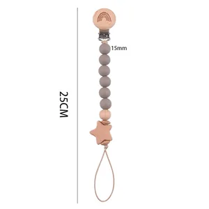 Handmade beech wood pacifier clip with rainbow engraving and grey silicone beads