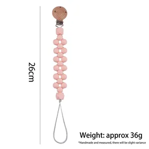 Pink silicone and beech wood baby pacifier clip chain, length 26cm, weight 36g