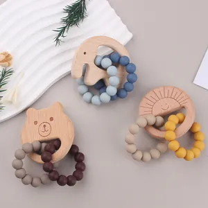Three-piece baby teething set with wooden animal rings and soft silicone bead accents