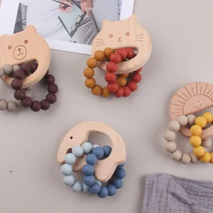 Detailed set of baby beech wood and silicone animal teethers with colorful beads